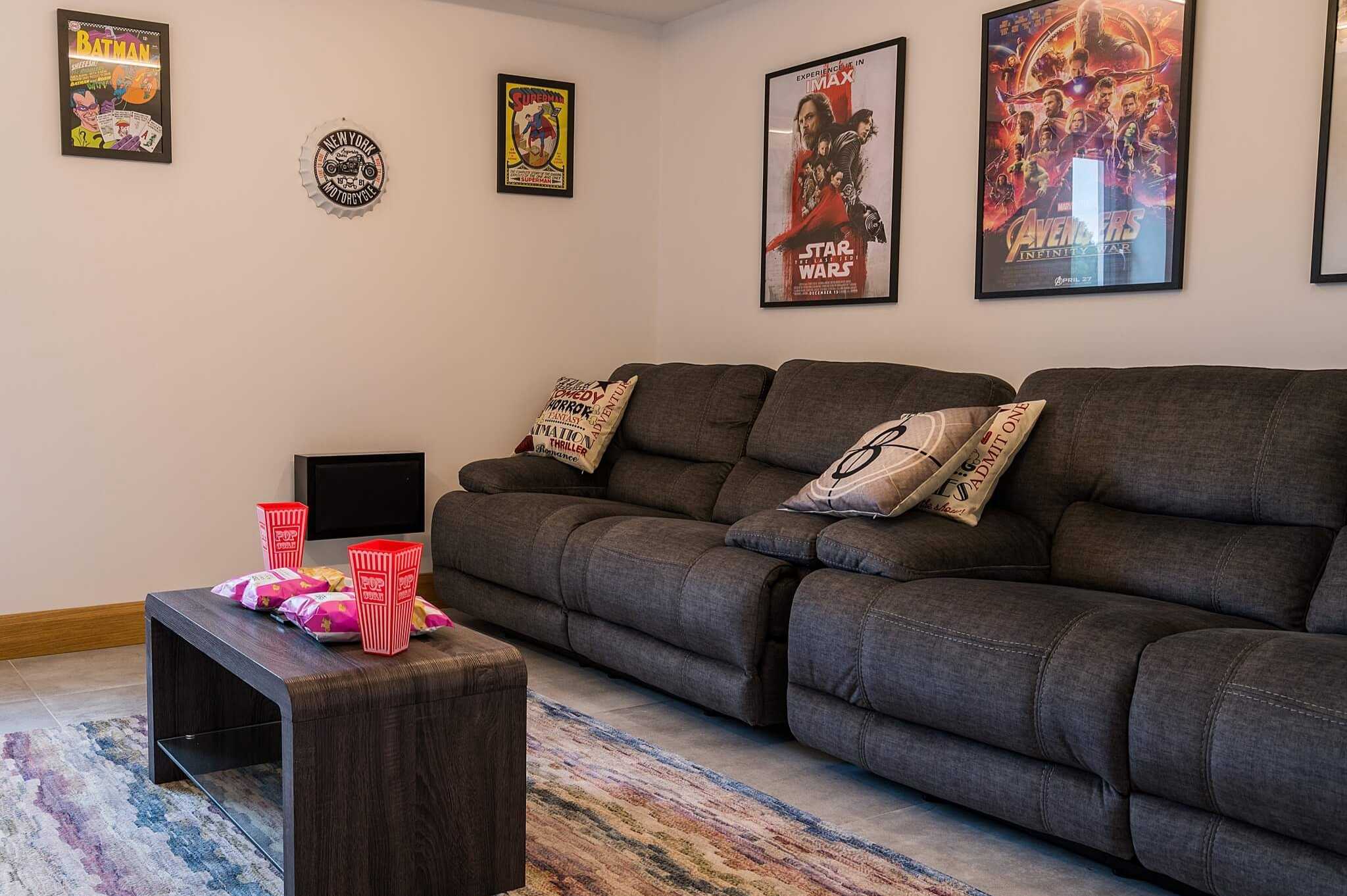 home cinema room with sofas and film posters